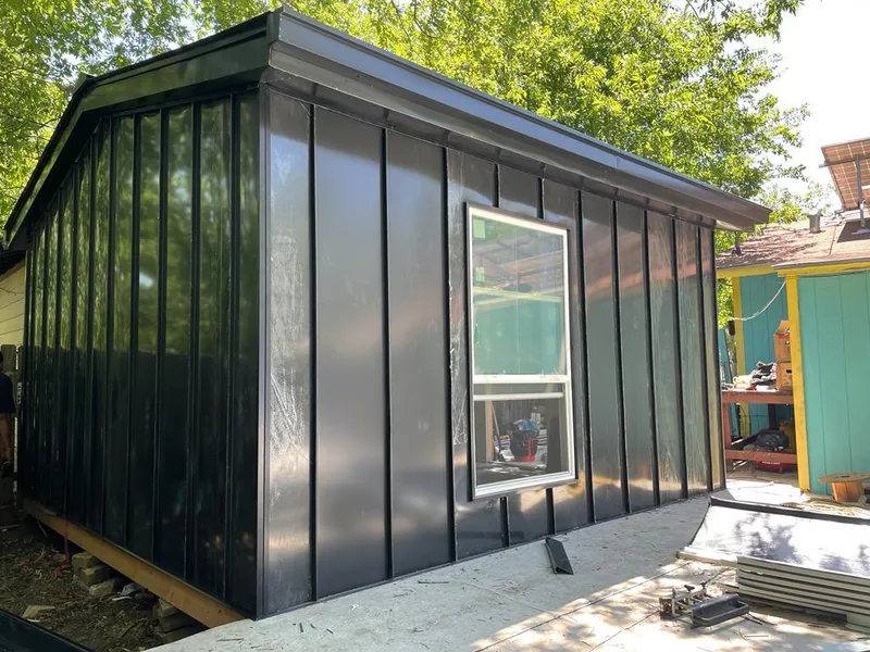Black standing seam metal wall panels for Metal Roof Installation in Clemson University